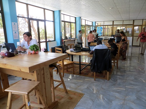 People working at desks at Kili Hub coworking space Moshi